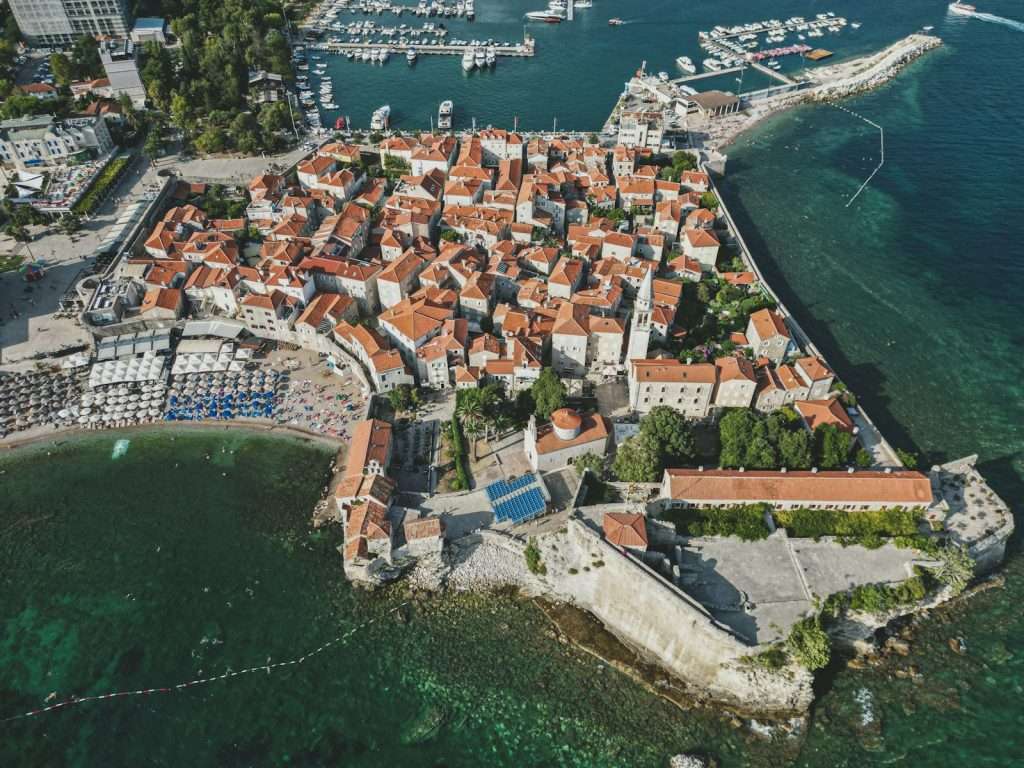 an aerial view of budva by the water