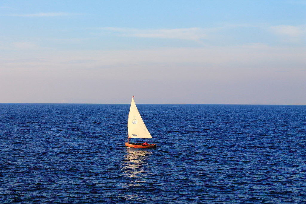 Sailing catamaran on the Tyrrhenian Sea under a blue sky