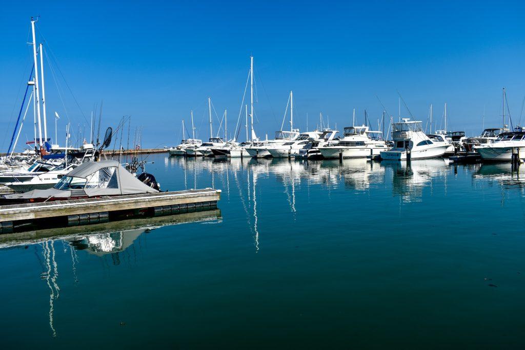 docked boats during day